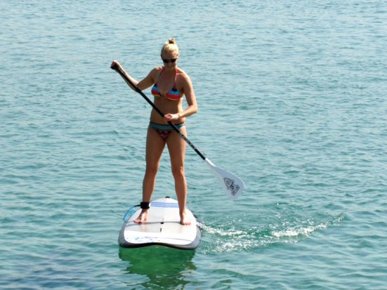 photo of Sara paddle surfing